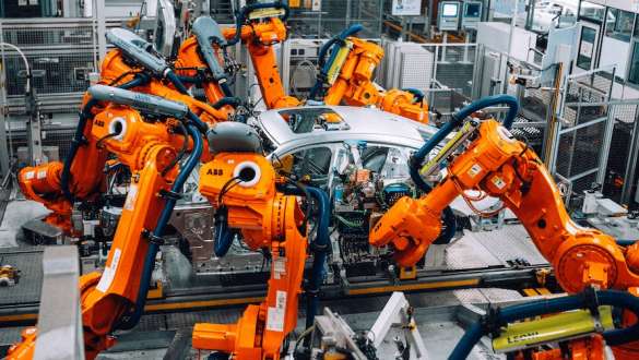 Robots at the BMW Group plant building a car body.