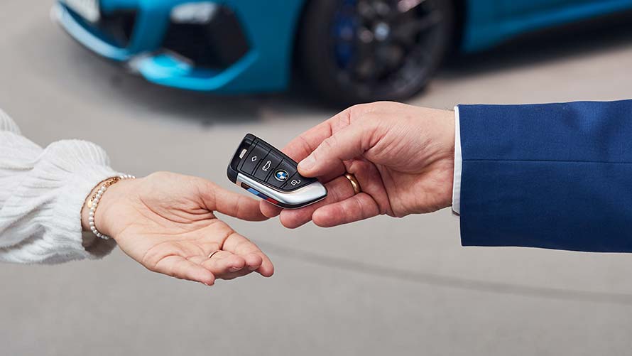 Handing over the keys at BMW Welt during car pickup