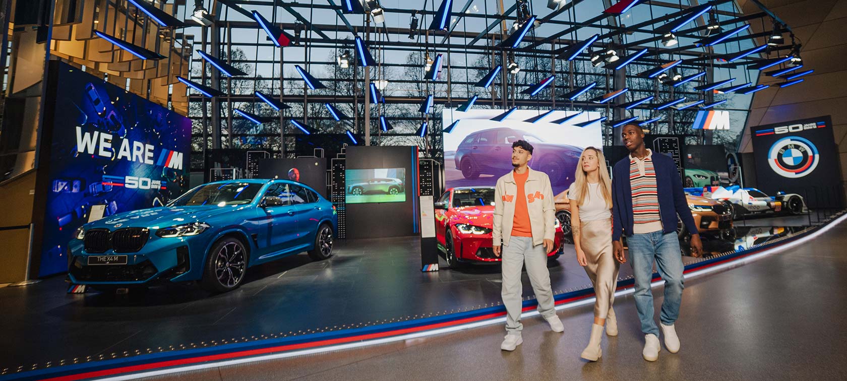 Visitors to the BMW Welt tour the exhibitions