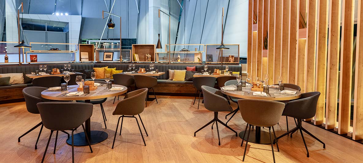 interior view of the bavarie in the bmw welt with a cozy ambience due to wood and warm materials..