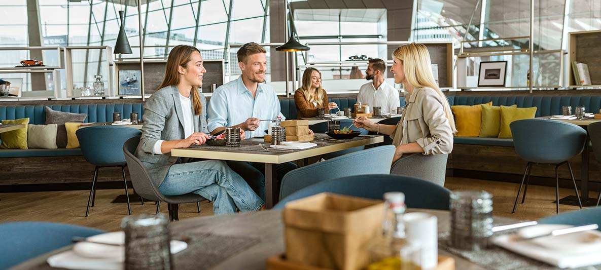 smiling people enjoy bavarie food together in bmw welt smiling people enjoy bavarie food together in bmw welt