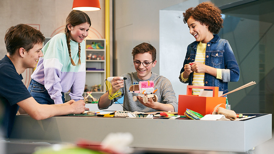 BMW Welt School Workshops Children tinker with a futuristic car at the BMW Welt creative workshop