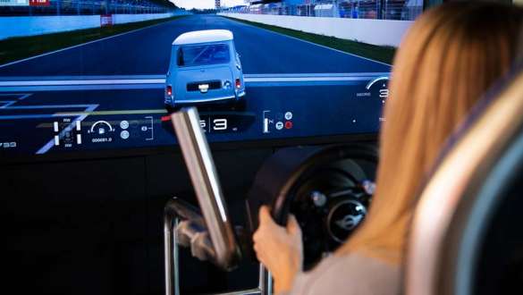 woman tests the mini simulator in the bmw welt exhibition